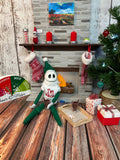 Adopt a holiday Skeleton Santa Elf